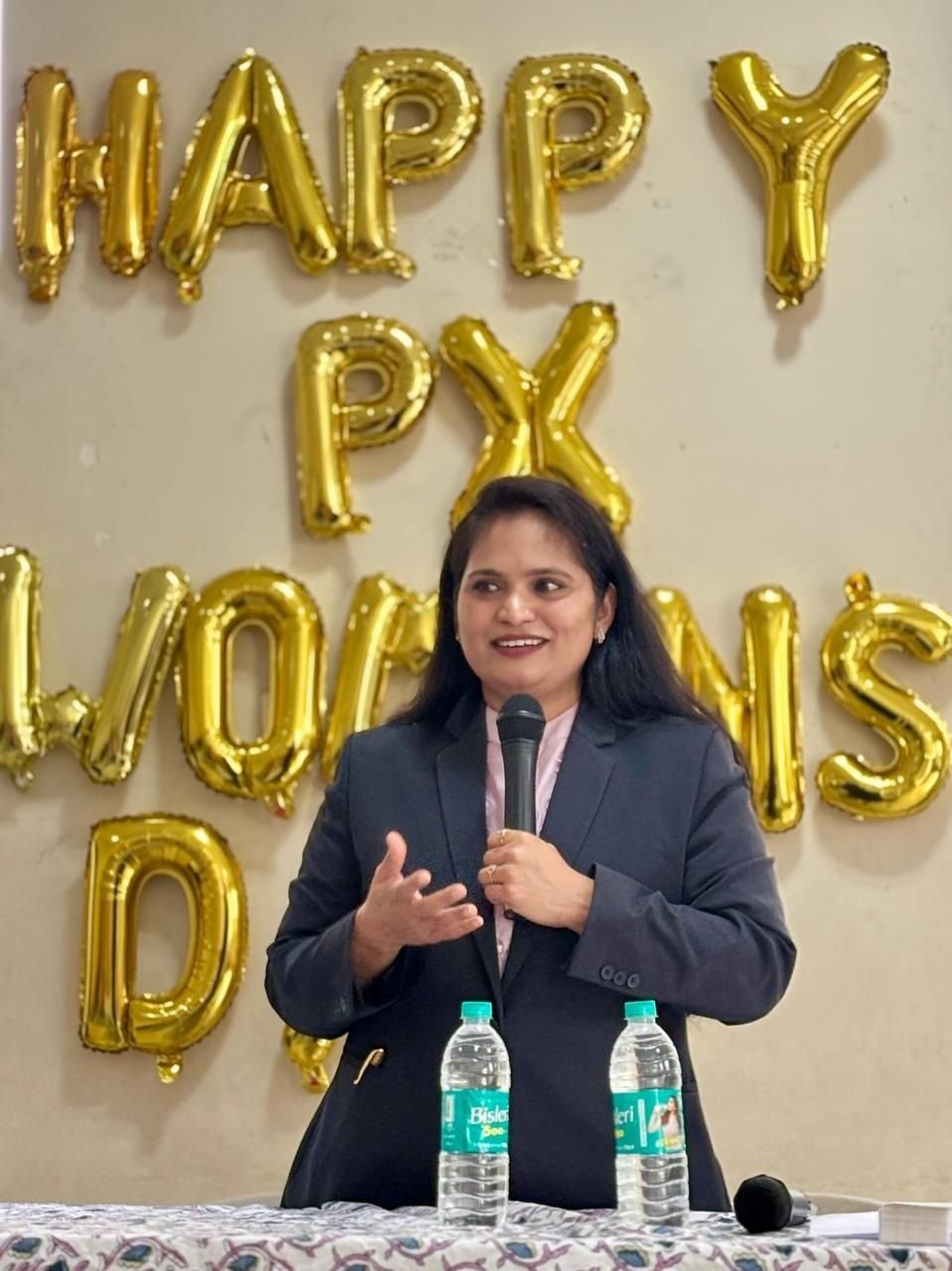 Adv. Shetall Sumbre speaking at a Women's Day legal awareness session in Balewadi